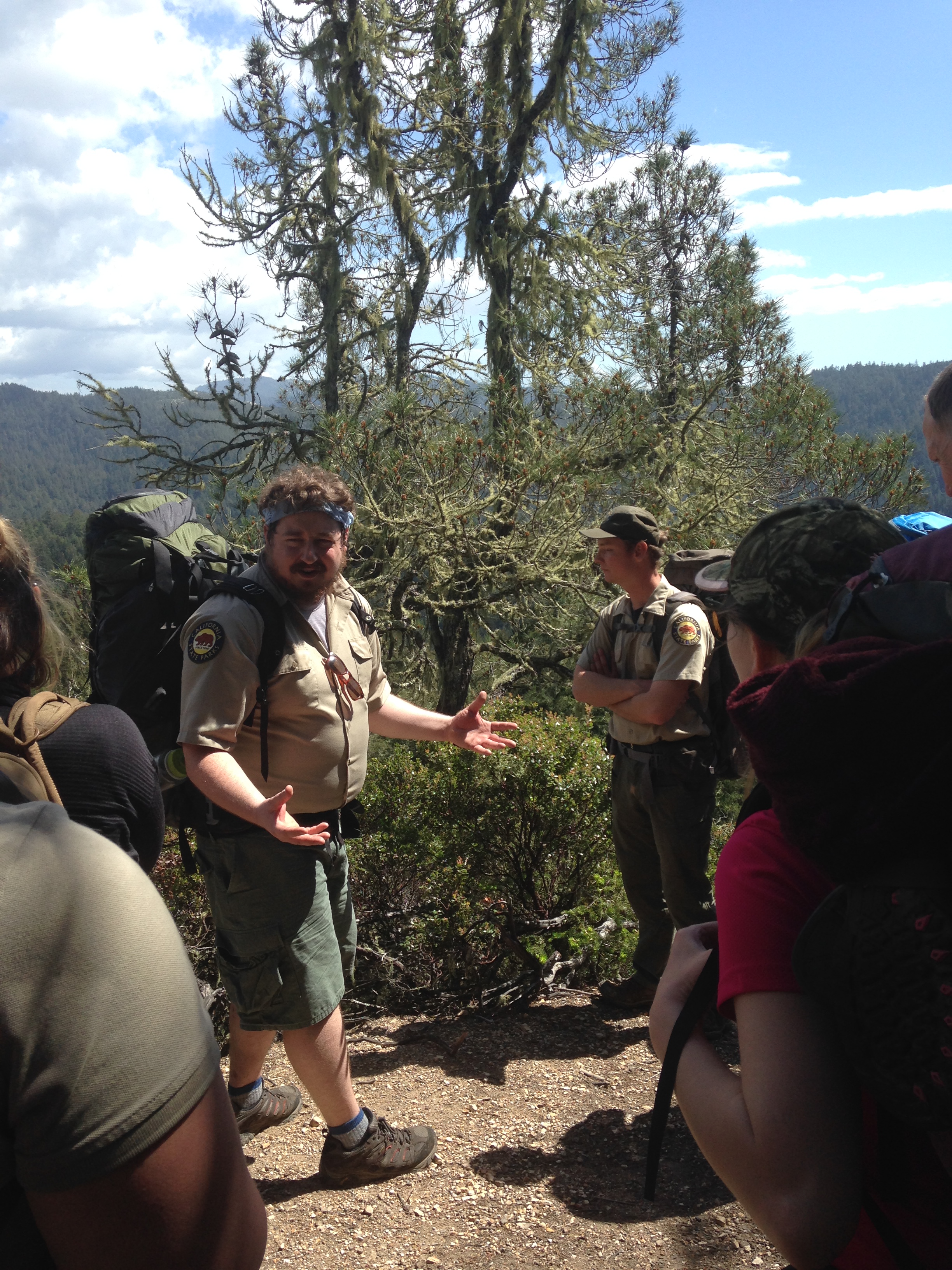 Guide Alex talking to a group of backpackers along Butano Ridge